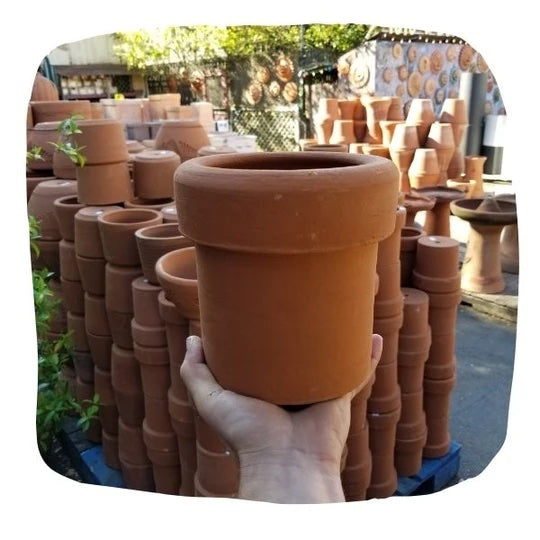 A terracotta pot with a large, thick border at the top.