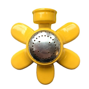 A yellow metal sprinkler with a silver center. It is shaped like a daisy.