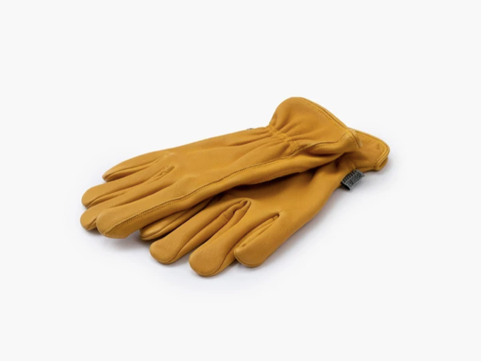 A pair of tan leather work gloves stacked on top of each other.