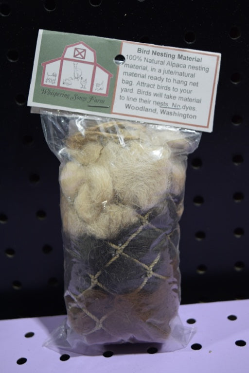 A plastic bag full of various nesting material, including jute and alpaca wool.