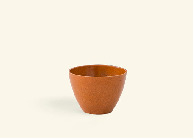 A reddish brown small pot.